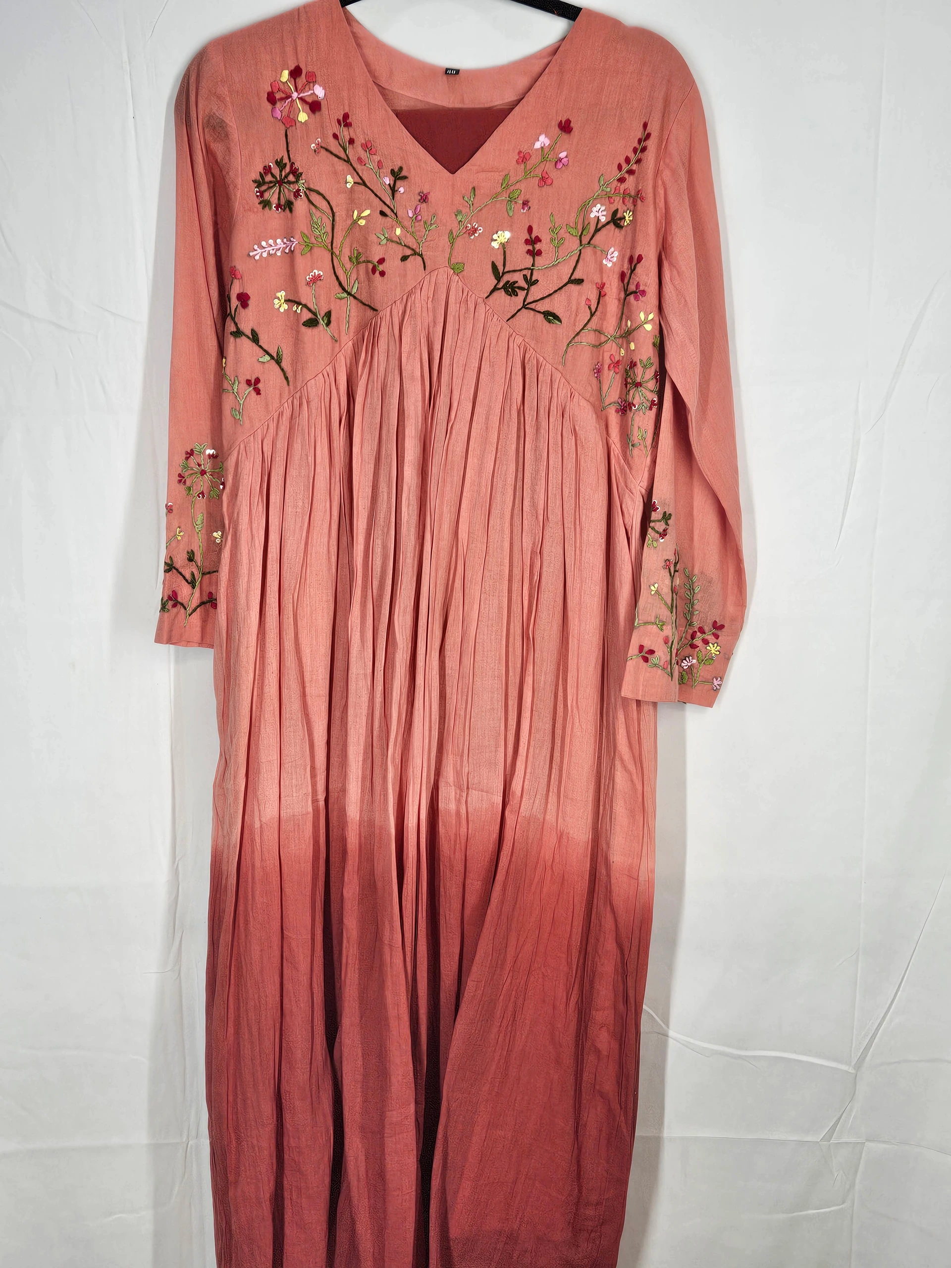 Pure mul cotton 2-piece ethnic set in soft peach, featuring intricate floral embroidery on the bodice and sleeves, perfect for timeless elegance.