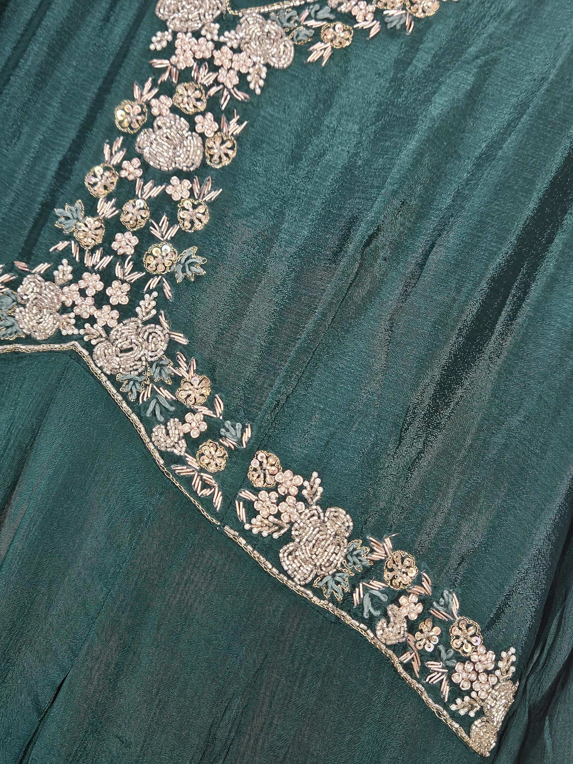 Elegant pure Chinon Anarkali gown in deep green with intricate silver floral embroidery, perfect for weddings and festive occasions.