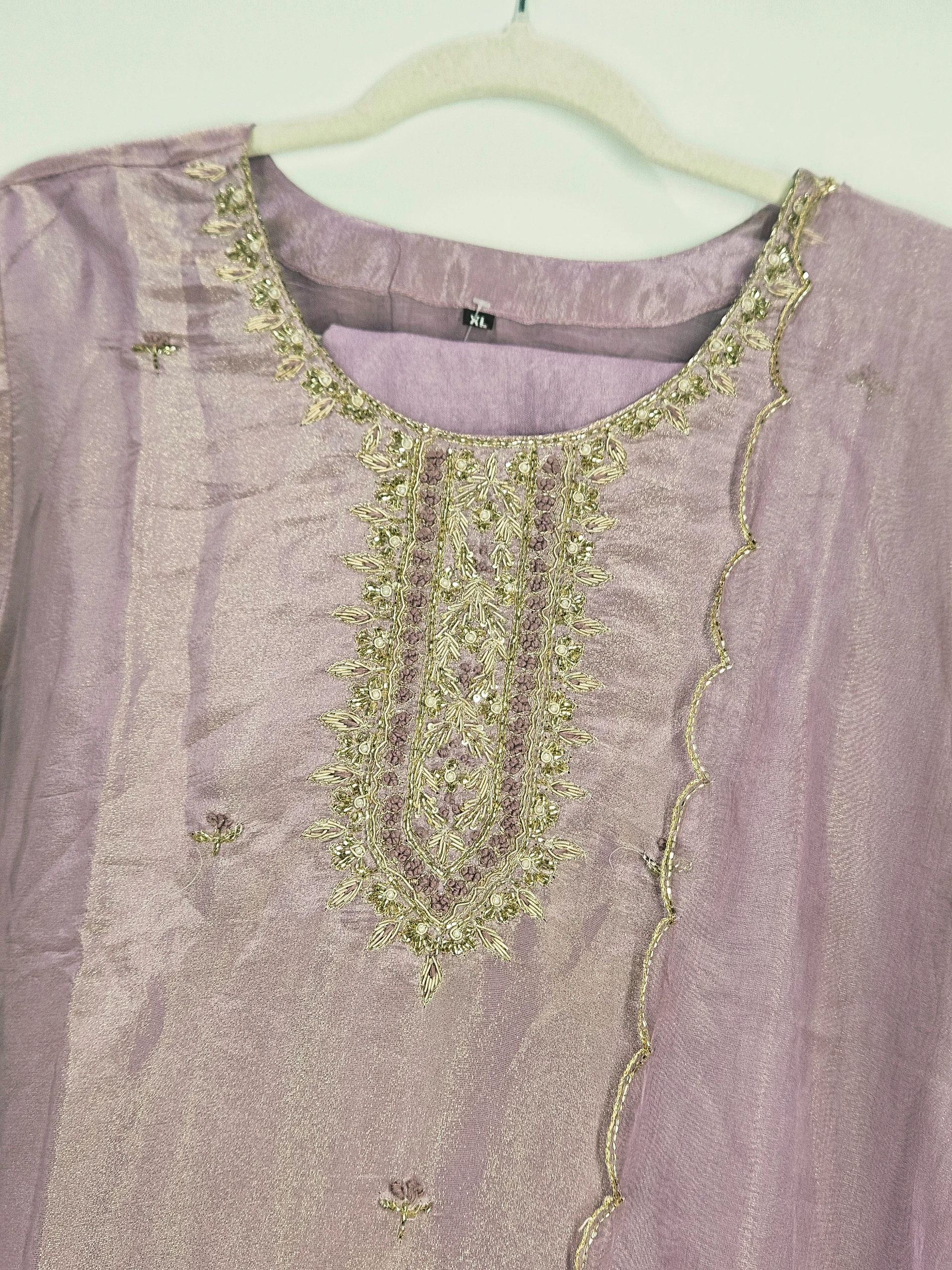 Luxurious pure tissue silk dress in soft lavender with intricate gold embroidery and beadwork, perfect for weddings and festive celebrations.