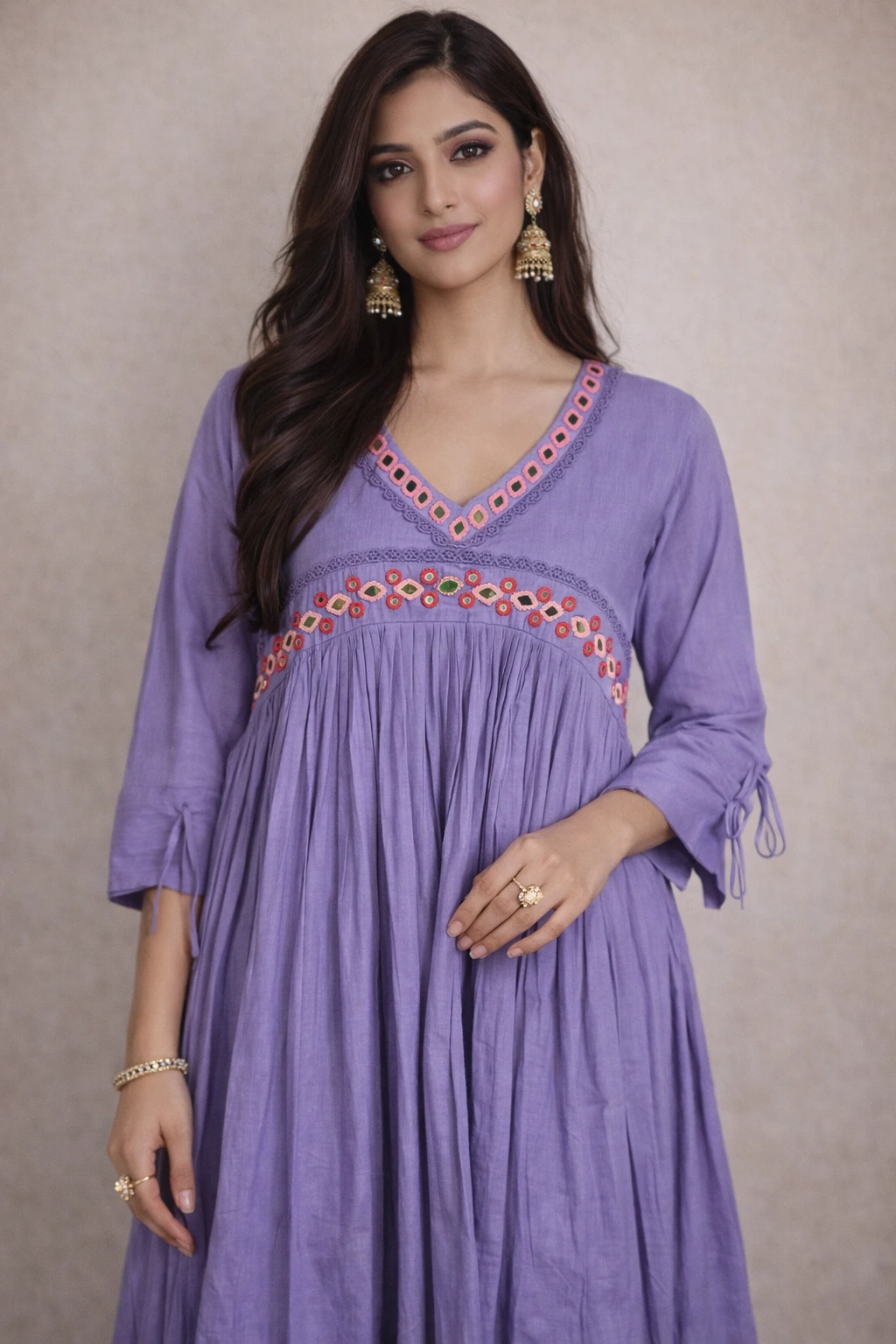 Handcrafted pure mul cotton frock in lavender with a V-neckline, intricate embroidered detailing, and three-quarter tie-up sleeves.