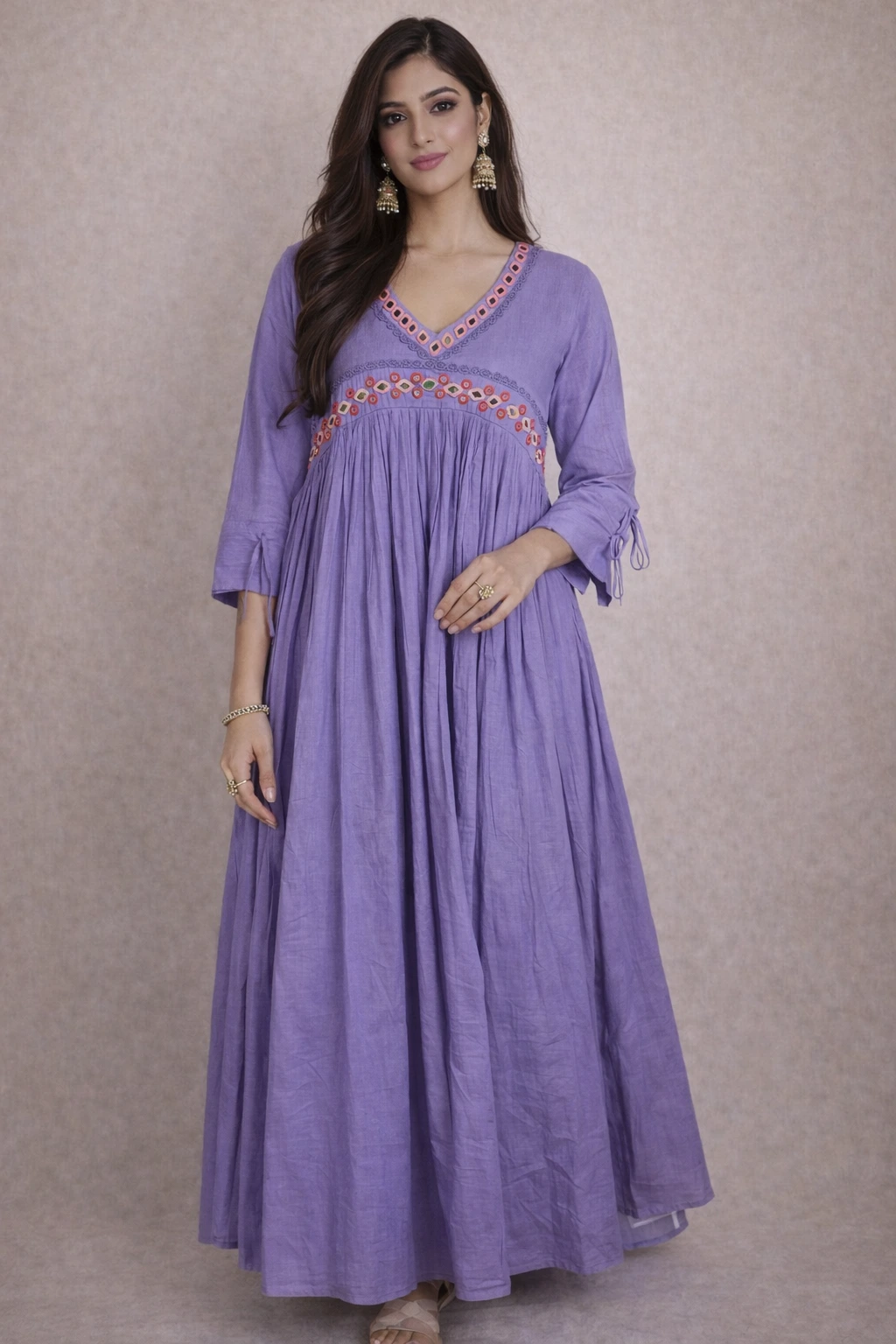 Handcrafted pure mul cotton frock in lavender with a V-neckline, intricate embroidered detailing, and three-quarter sleeves.