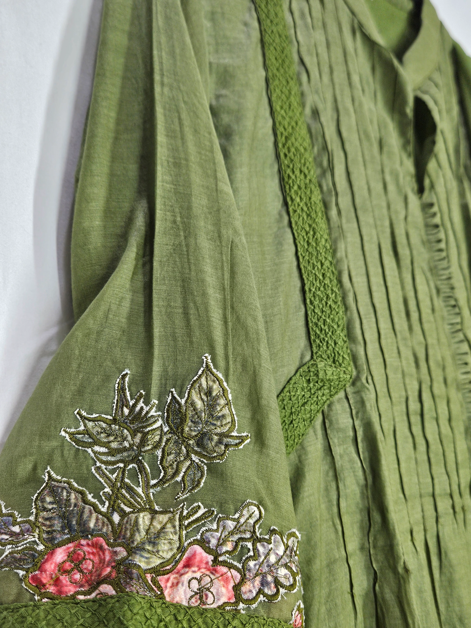 Pure Mul Chanderi 3-piece suit in olive green with intricate floral embroidery on the sleeve and delicate pleated detailing.