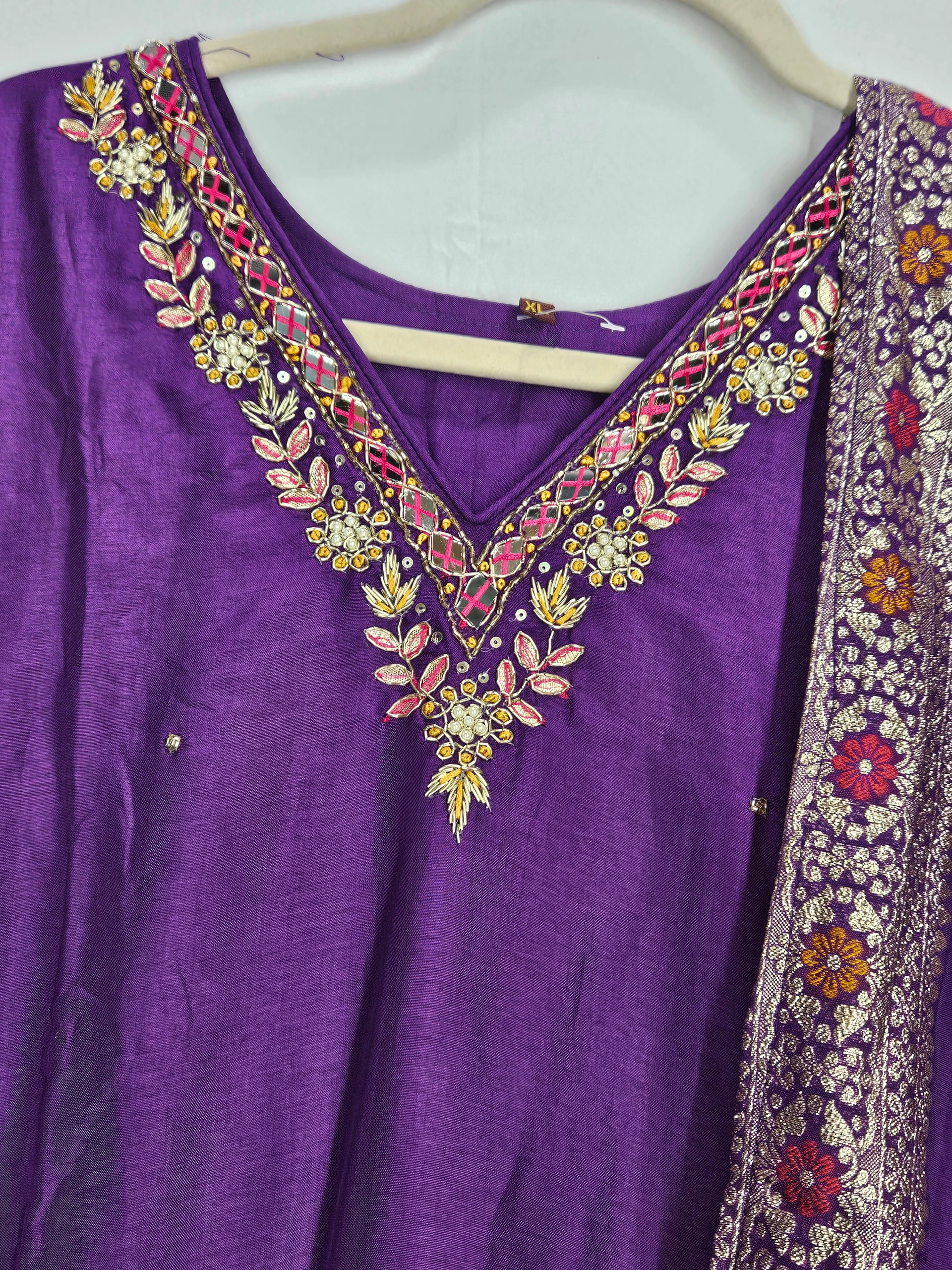 Purple Pure Dola Silk dress with intricate floral embroidery on the neckline, paired with a matching dupatta featuring vibrant floral patterns.