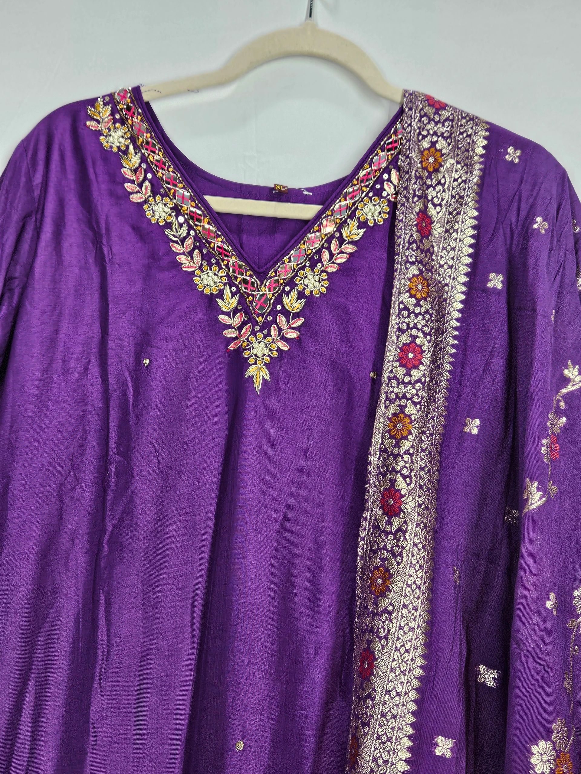 Purple Pure Dola Silk dress with intricate floral embroidery on the neckline and a matching embroidered dupatta, exuding timeless ethnic elegance.