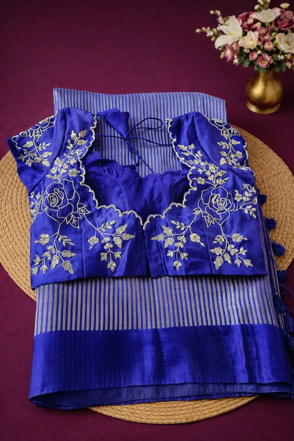 Pure Banarasi Kora tissue silk saree in royal blue with silver zari stripes, paired with an embroidered floral blouse