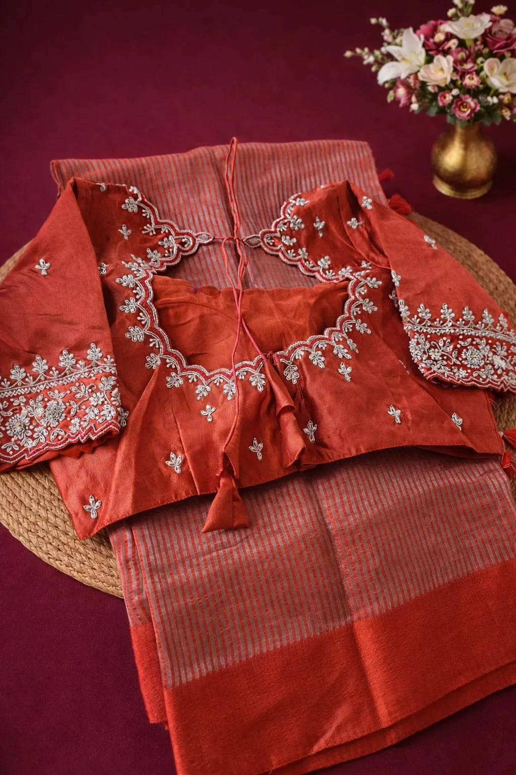 Pure Banarasi silk tissue saree in rich red with intricate silver embroidery, perfect for weddings and festivals.