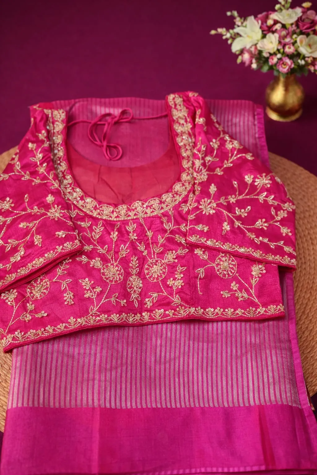 Elegant Pure Banarasi Kora Tissue Silk Saree in vibrant pink with intricate gold floral embroidery, perfect for weddings and festivals.
