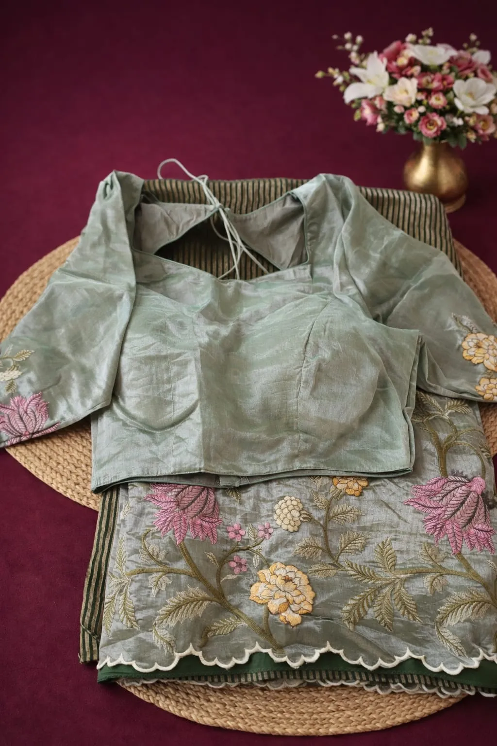 Elegant Banarasi Kora tissue saree in sage green with floral embroidery and matching blouse, perfect for weddings