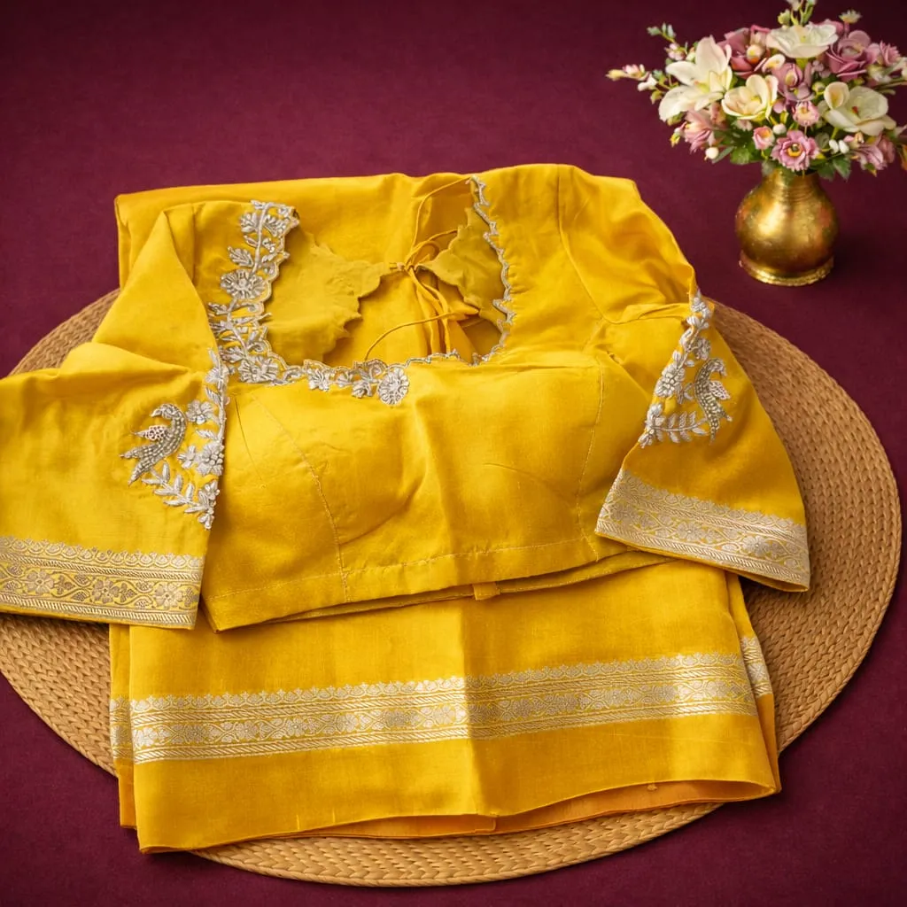 Luxurious Pure Banarasi Raw Mango Handloom Saree in vibrant yellow with intricate silver embroidery, perfect for festive elegance.