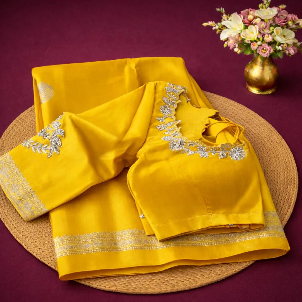 Luxurious Pure Banarasi Raw Mango Handloom Saree in vibrant yellow with intricate silver embroidery, perfect for festive elegance.