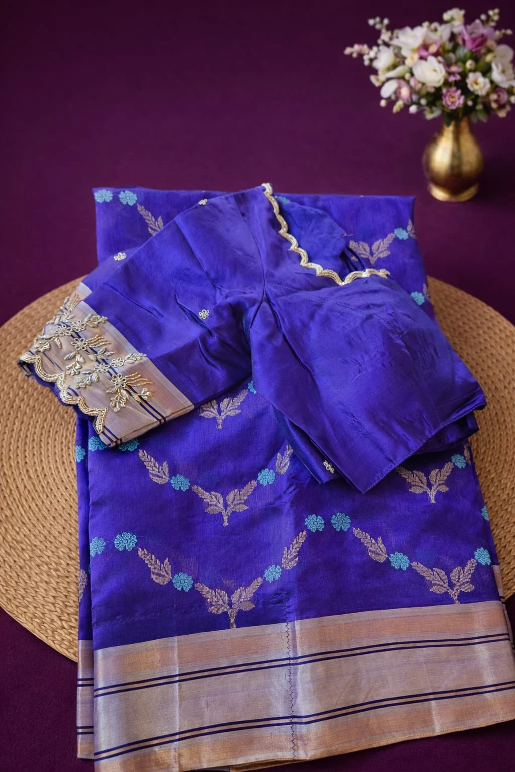 Pure Chanderi Pattu silk saree in royal blue with handwoven golden zari border and floral motifs, paired with blouse.