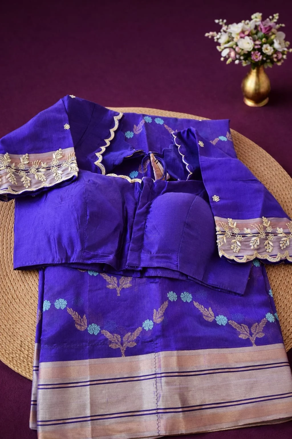 Pure Chanderi Pattu silk saree in royal purple with handwoven golden zari border, matching blouse, and floral motifs.