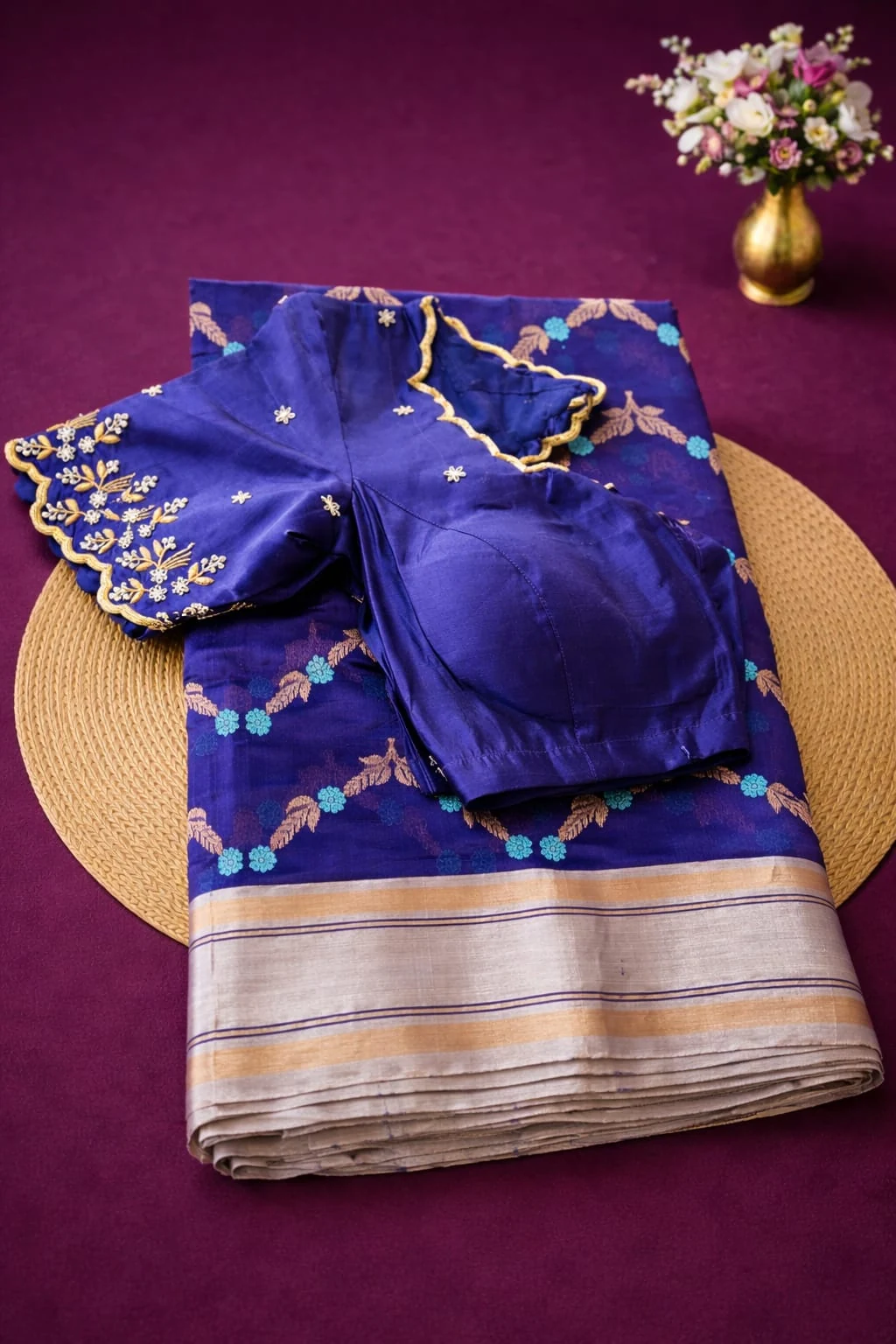 Handwoven pure Chanderi Pattu silk saree in royal blue with gold zari border, floral motifs, and matching blouse piece.