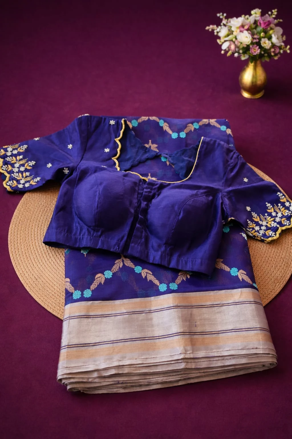 Handwoven pure Chanderi Pattu silk saree in beige with blue floral border, paired with a blue embroidered blouse.