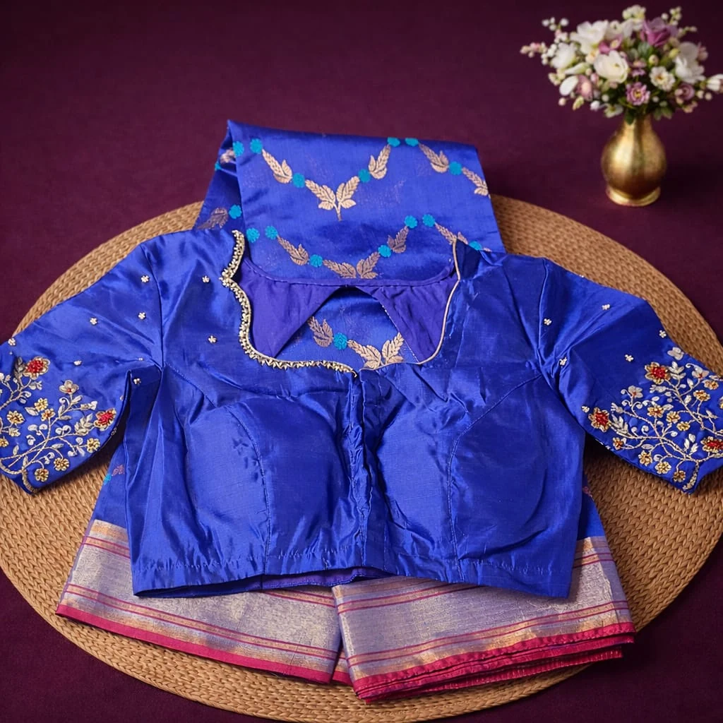 Pure Chanderi Pattu silk saree in royal blue with handwoven gold motifs, paired with an embroidered blouse and silver border.