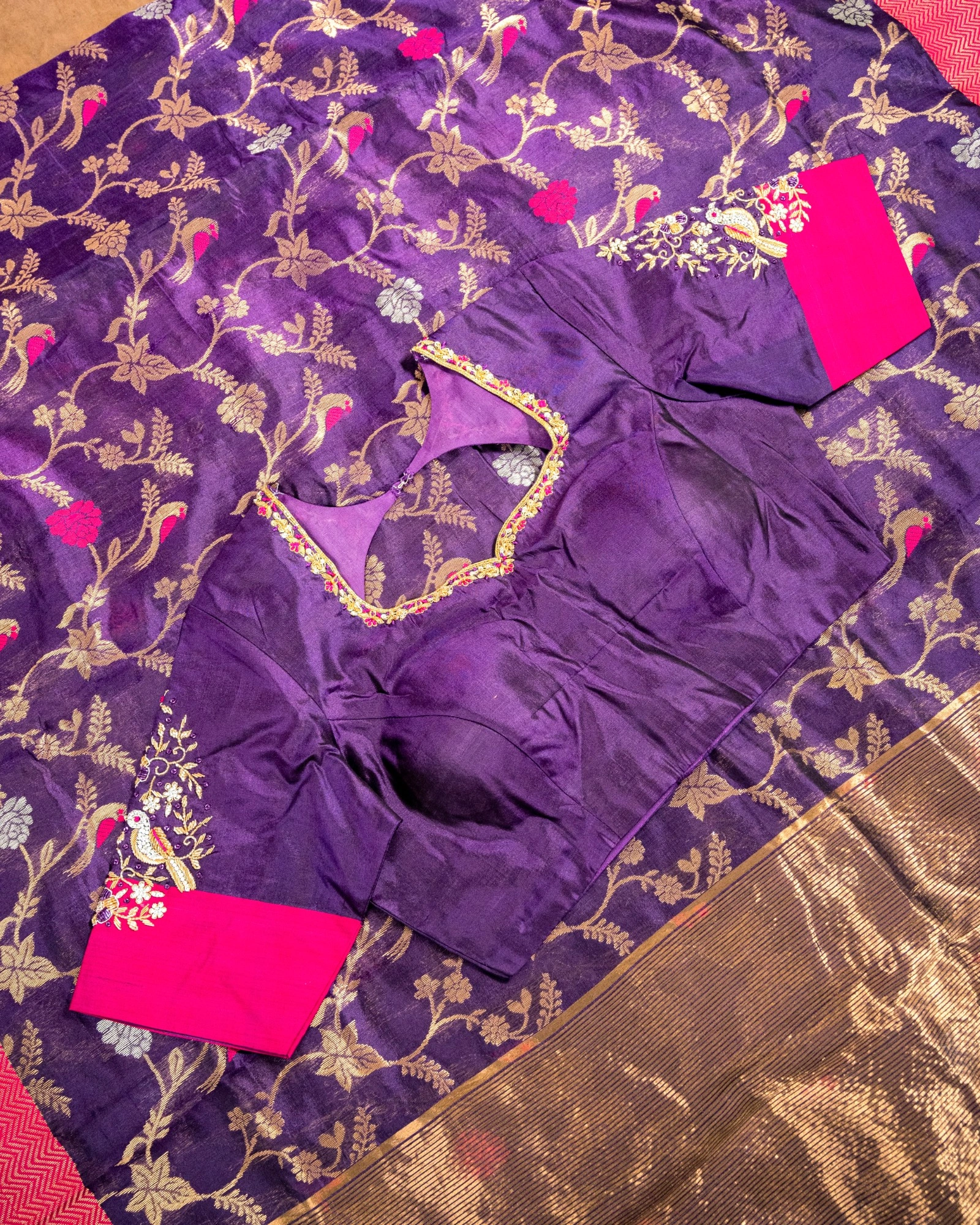 Pure Chanderi pattu saree in rich purple with gold floral motifs, paired with a purple maggam work blouse and pink sleeves.